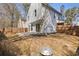 A spacious backyard with privacy fence, concrete patio, mature trees and space to play at 851 Ashley Ln, Stone Mountain, GA 30087