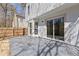 Exterior shot of the patio featuring sliding glass doors and view of the fenced yard at 851 Ashley Ln, Stone Mountain, GA 30087