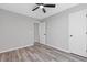 A bright bedroom featuring modern ceiling fan and neutral color palette, and new floors at 851 Ashley Ln, Stone Mountain, GA 30087