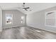 Spacious bedroom featuring vaulted ceiling, ceiling fan, and many windows letting in natural light at 851 Ashley Ln, Stone Mountain, GA 30087