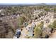 Wide aerial shot of neighborhood with single Gathering homes and a mountain in the distance at 851 Ashley Ln, Stone Mountain, GA 30087