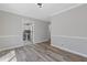 Dining room featuring modern flooring and walls, with a view into the bright kitchen at 851 Ashley Ln, Stone Mountain, GA 30087