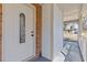 View of a decorative front door under a covered porch with brick facade and white trim at 851 Ashley Ln, Stone Mountain, GA 30087