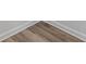 Close-up of gray wood-look flooring with white trim at 851 Ashley Ln, Stone Mountain, GA 30087