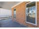 Cozy covered porch featuring a brick facade and providing ample light and shade at 851 Ashley Ln, Stone Mountain, GA 30087