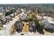 Aerial view of a quiet residential neighborhood with well-maintained homes, mature trees, and neatly manicured lawns at 1039 Bramble Way, Grayson, GA 30017