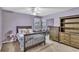 Charming bedroom with a plush bed, wooden dresser, and ample natural light at 1039 Bramble Way, Grayson, GA 30017