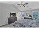 Bedroom features vaulted ceiling, modern furnishings, and a TV at 1039 Bramble Way, Grayson, GA 30017