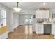 Bright kitchen with stainless steel appliances, light wood floors, and an eat-in breakfast nook at 1039 Bramble Way, Grayson, GA 30017