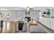 Bright living room with hardwood floors, fireplace, and backyard access creates a cozy and inviting space at 1039 Bramble Way, Grayson, GA 30017