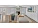Bright living room with hardwood floors, fireplace, and backyard access creates a cozy and inviting space at 1039 Bramble Way, Grayson, GA 30017
