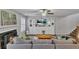 Inviting living room with a cozy fireplace, built-in shelving, and comfortable seating at 1039 Bramble Way, Grayson, GA 30017