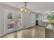 Spacious living room has light-filled french doors that open to a backyard at 1039 Bramble Way, Grayson, GA 30017