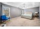 Bright main bedroom featuring a trey ceiling, neutral carpet, and large windows at 164 Diamond Ridge Ave, Canton, GA 30114