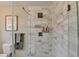 Modern bathroom shower featuring beautiful marble tile, glass door and bathroom fixtures at 2945 Monterey Dr, Decatur, GA 30032