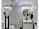 Well-lit bathroom showcasing modern fixtures, round mirror, and a clean aesthetic at 2945 Monterey Dr, Decatur, GA 30032