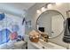 Bathroom features a round mirror, modern vanity, and decorative shower curtain at 2945 Monterey Dr, Decatur, GA 30032