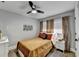 Bright bedroom features a ceiling fan, stylish decor, and a comfortable bed at 2945 Monterey Dr, Decatur, GA 30032