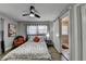 Inviting bedroom features a neutral color palette, ceiling fan and hardwood floors at 2945 Monterey Dr, Decatur, GA 30032