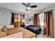 Bedroom features two beds, stylish curtains, and a ceiling fan for added comfort at 2945 Monterey Dr, Decatur, GA 30032