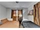 Bedroom featuring hardwood floors, a ceiling fan and a large window at 2945 Monterey Dr, Decatur, GA 30032