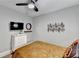 Bedroom featuring a ceiling fan, a modern dresser, and stylish wall art at 2945 Monterey Dr, Decatur, GA 30032