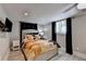 Comfortable bedroom with a large window, ceiling fan and wall-mounted TV at 2945 Monterey Dr, Decatur, GA 30032