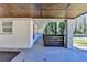 Charming carport area with a wood-paneled ceiling and a view of the front yard at 2945 Monterey Dr, Decatur, GA 30032