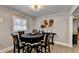 Charming dining room with ample seating and tasteful decor, creating an inviting atmosphere for meals and entertaining at 2945 Monterey Dr, Decatur, GA 30032