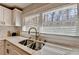 View of sink area featuring new faucet, window and marble countertops at 2945 Monterey Dr, Decatur, GA 30032