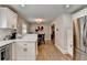 Bright kitchen featuring stainless refrigerator and breakfast bar overlooking dining area at 2945 Monterey Dr, Decatur, GA 30032