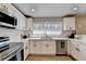 Kitchen with stainless appliances, ample cabinet space, and natural light at 2945 Monterey Dr, Decatur, GA 30032