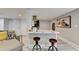 Stylish kitchen features an island, breakfast bar seating, and modern finishes, with an adjoining living area at 2945 Monterey Dr, Decatur, GA 30032