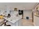 The kitchen area offers bar seating, white countertops, modern appliances, and hardwood flooring at 2945 Monterey Dr, Decatur, GA 30032