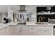 Modern kitchen features white cabinets, stainless steel appliances, and updated backsplash and hardware at 2945 Monterey Dr, Decatur, GA 30032