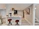 The eat-in kitchen includes an island with barstool seating, stainless hood and modern finishes at 2945 Monterey Dr, Decatur, GA 30032