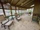 Enjoy the outdoors from this sunroom with multiple chairs and tables, offering a relaxing space for gatherings at 4341 Kings Ne Way, Marietta, GA 30067