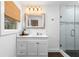 A bright bathroom with a glass shower, and a bamboo window shade at 1300 Valley Ct, Roswell, GA 30075