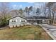 Charming single story home with grey siding, a covered carport, and a well-maintained lawn at 1300 Valley Ct, Roswell, GA 30075