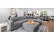 Open-concept living room, seamlessly flowing into a kitchen and dining area for modern living and entertaining at 1300 Valley Ct, Roswell, GA 30075