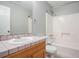 Bathroom featuring a sink vanity, toilet, and a shower and tub combo with a shower curtain at 1083 Lake Dr, Snellville, GA 30039