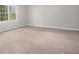 Bedroom with carpet floors and a bright window offering natural light at 1083 Lake Dr, Snellville, GA 30039