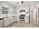 Updated kitchen featuring stainless steel appliances and subway tile backsplash at 1083 Lake Dr, Snellville, GA 30039