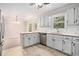 Open kitchen with white cabinets, stainless steel dishwasher, and peninsula seating at 1083 Lake Dr, Snellville, GA 30039