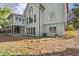 Beautiful backyard features a stone patio, offering a serene and private outdoor space at 160 Wing Mill Rd, Sandy Springs, GA 30350