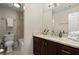 Bathroom with granite countertop and dark brown cabinets and vanity at 160 Wing Mill Rd, Sandy Springs, GA 30350