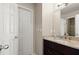 Bathroom with granite countertop, wood vanity, and white door at 160 Wing Mill Rd, Sandy Springs, GA 30350