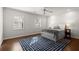 Bright bedroom with white walls, hardwood floors, ceiling fan, and two windows at 160 Wing Mill Rd, Sandy Springs, GA 30350