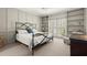 Bedroom featuring neutral walls, built-in shelves, a ceiling fan and plantation shutters at 160 Wing Mill Rd, Sandy Springs, GA 30350