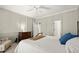Bedroom with decorative trim, neutral paint, and a comfortable bed with stylish linens at 160 Wing Mill Rd, Sandy Springs, GA 30350